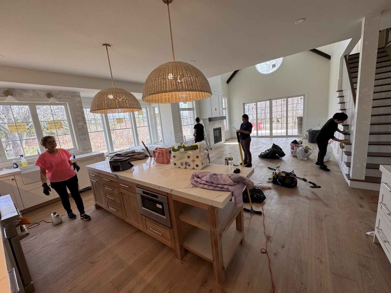 Gold Cleaners team working together inside a large home during a post-construction cleaning
